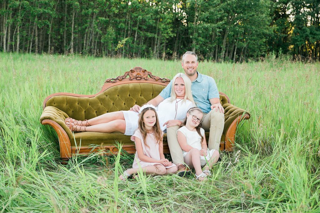 family photos, family of 4, sofa in a field, French Provincial sofa