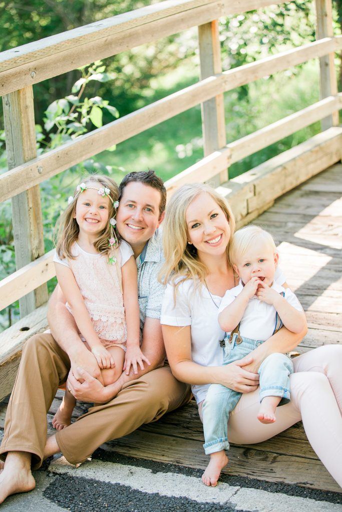 family photos, family sitting on bridge, family of 4, Confederation Park