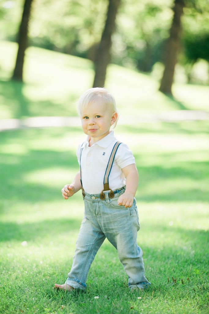 little boy, jeans and suspenders