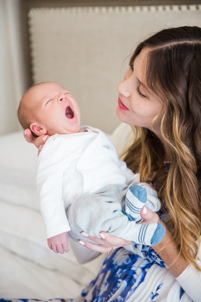lifestyle newborn photos, mom and newborn, baby yawning,