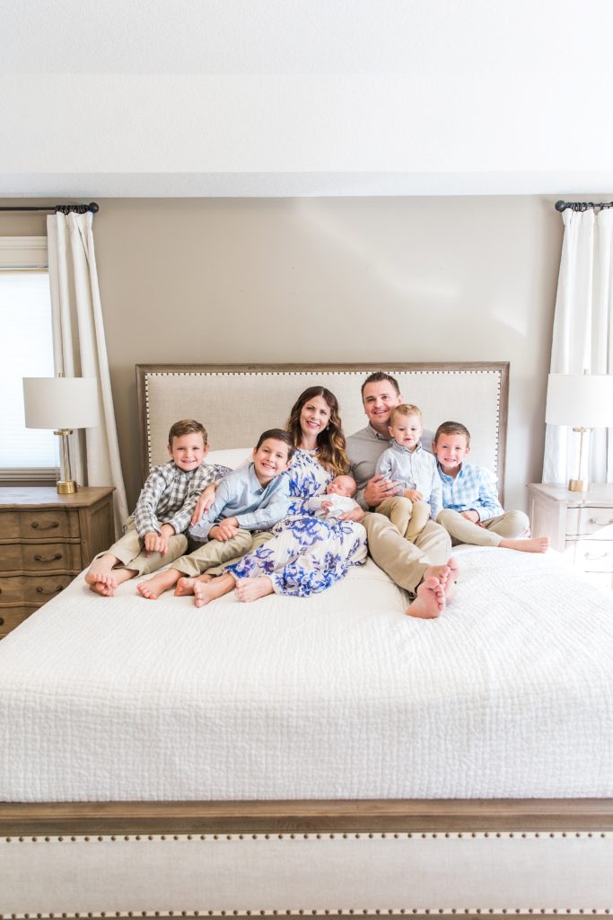 family of 7 on bed, at home family photos